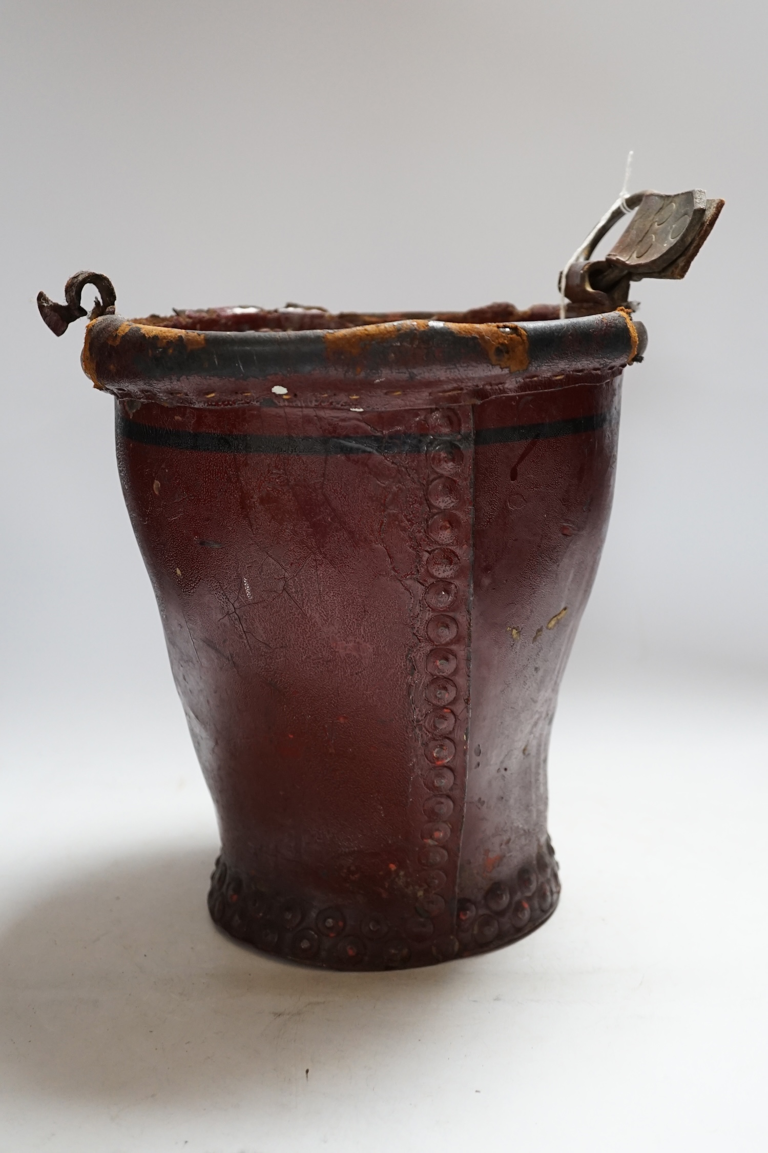 A Victorian leather fire bucket, 28cm high